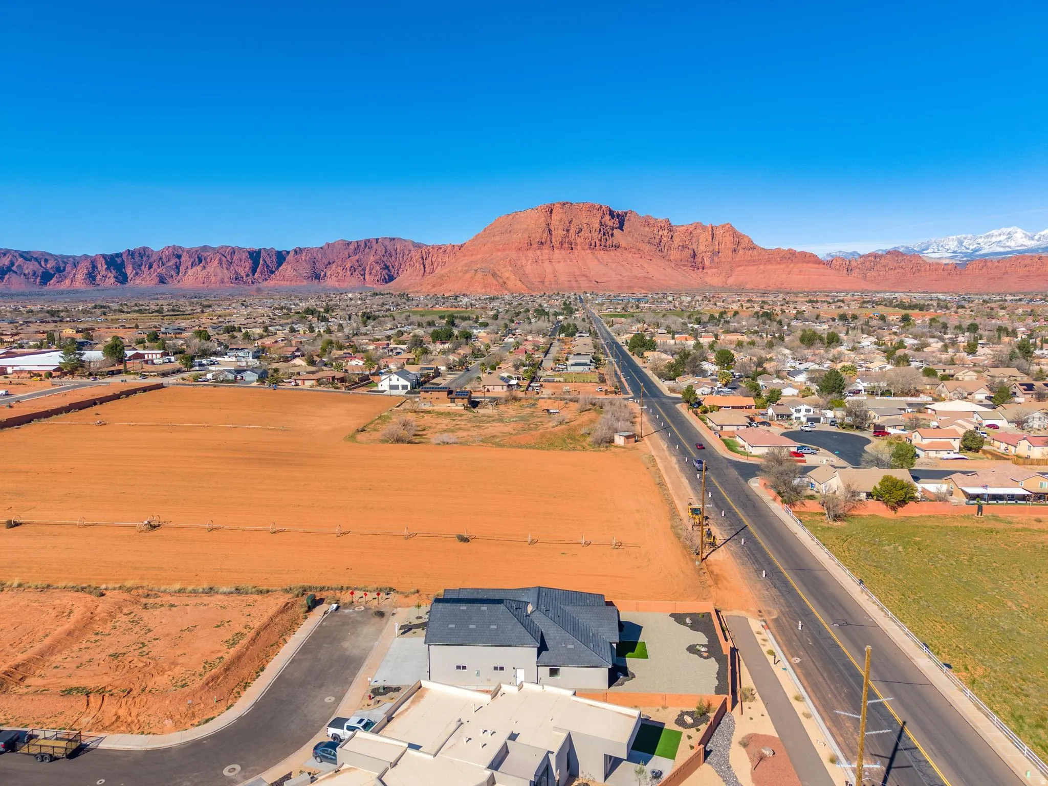 Aerial view of residential area with a mountain backdrop