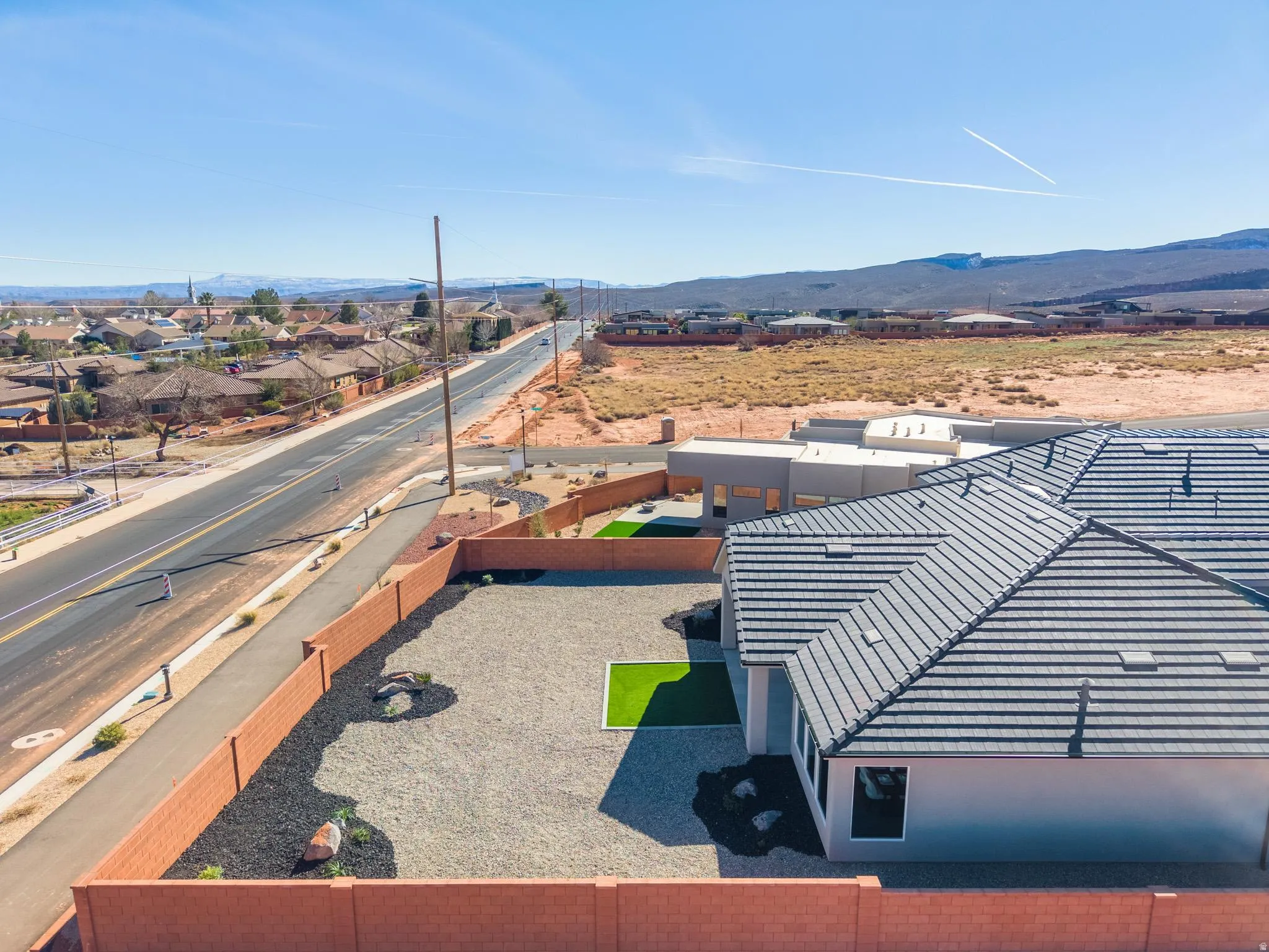 Aerial view of residential area with a mountain backdrop
