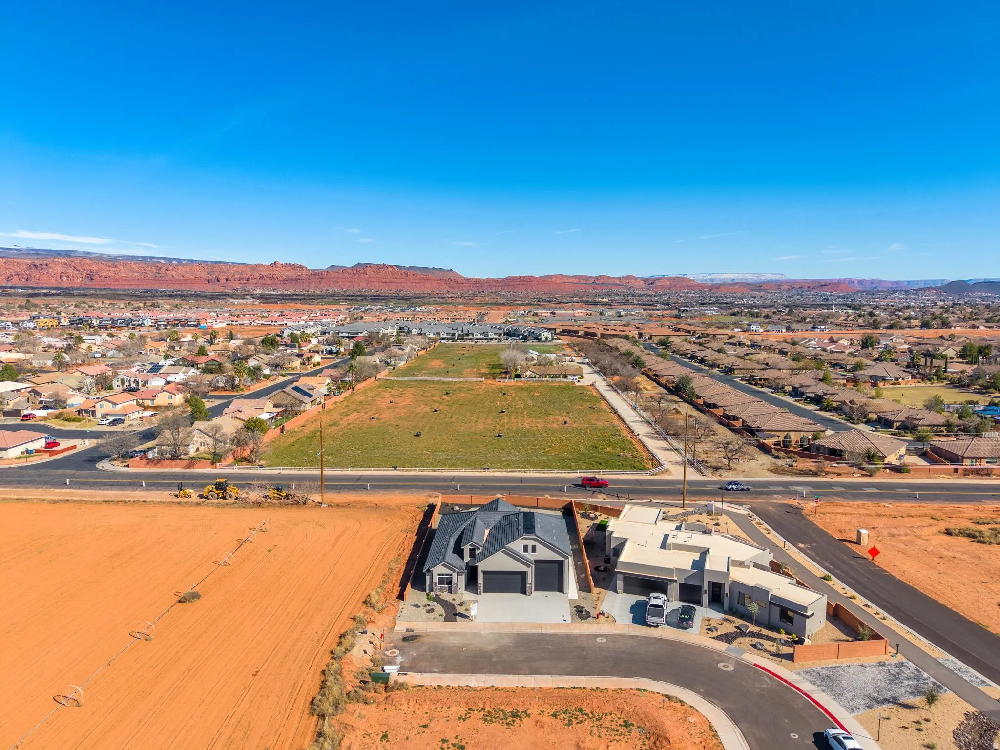 Aerial perspective of suburban area featuring a mountain backdrop