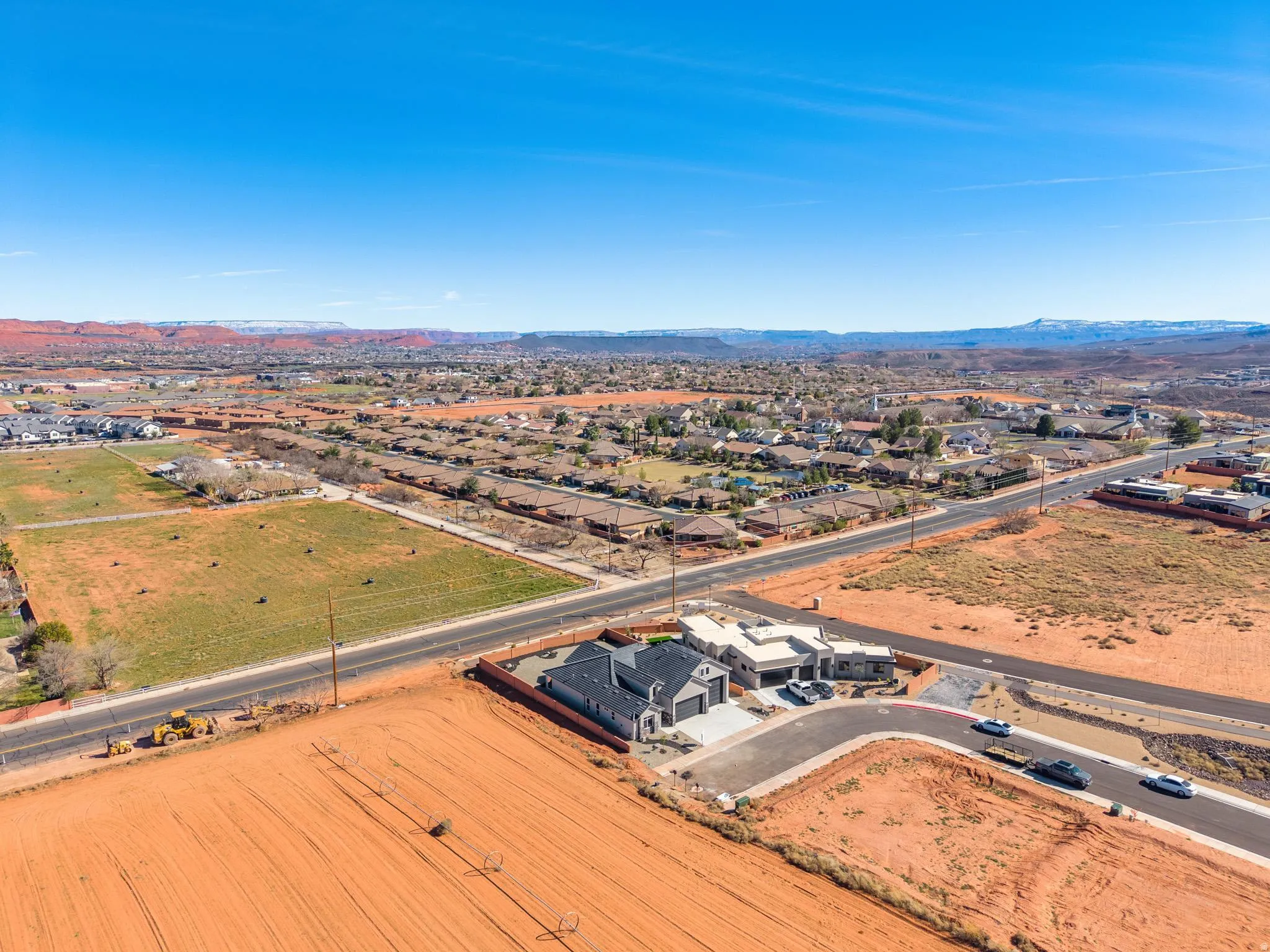Aerial view of residential area with a mountainous background