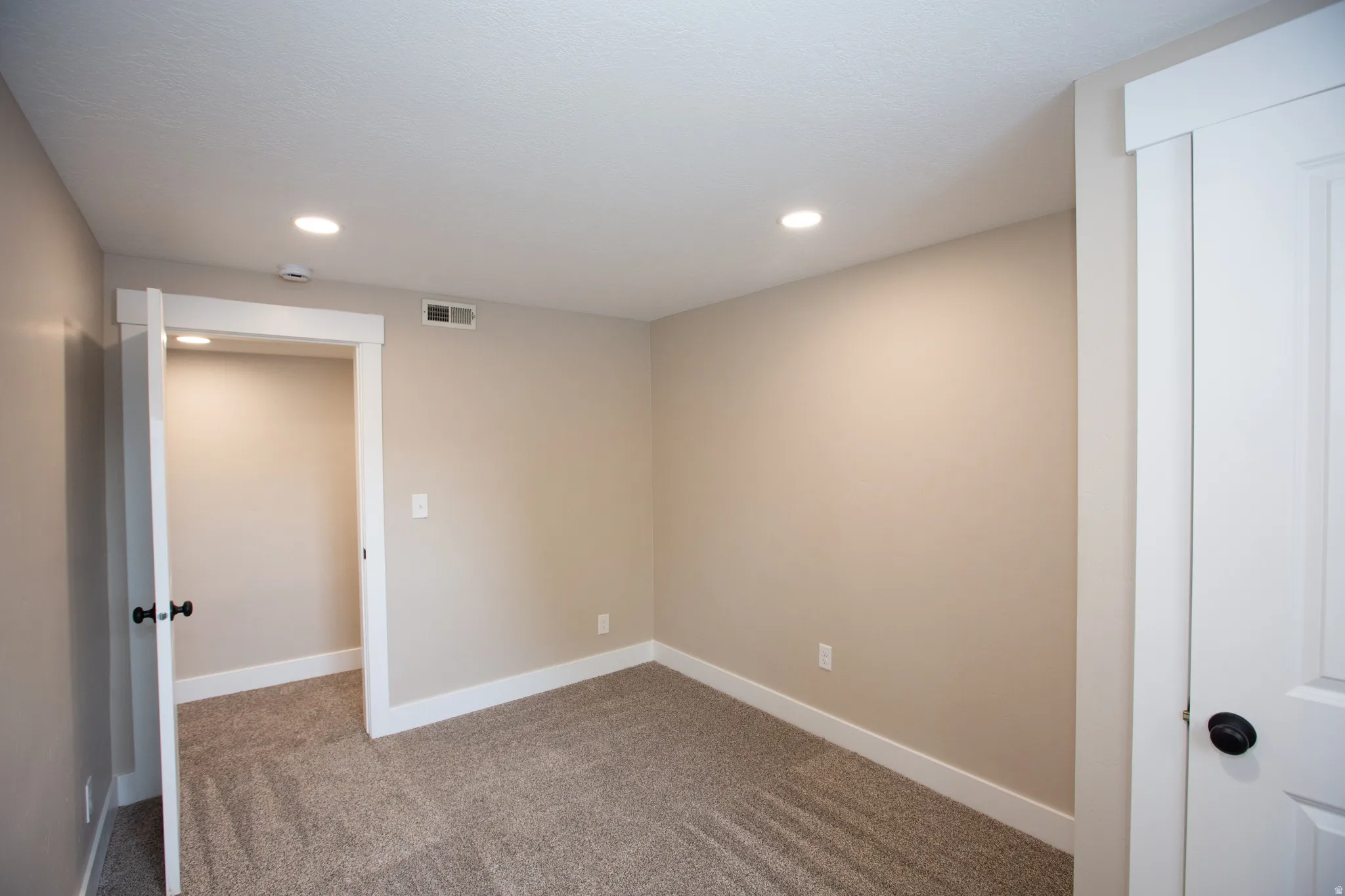 Carpeted bedroom 4 with baseboards and recessed lighting