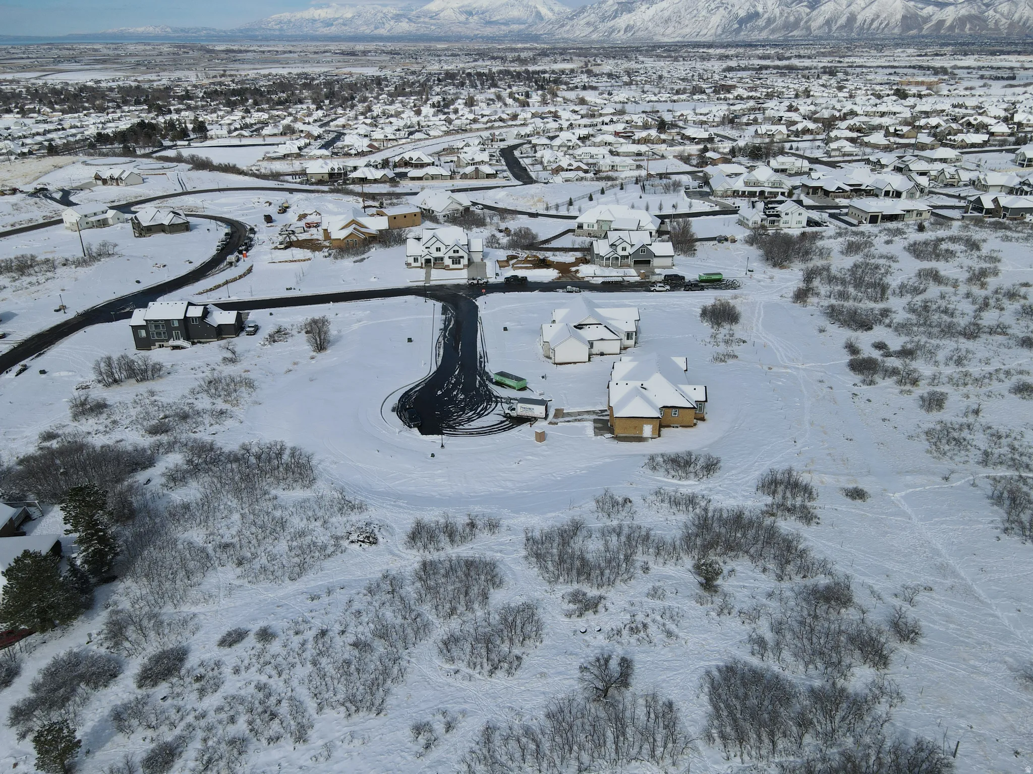 Snowy aerial view with a residential view and a mountain view