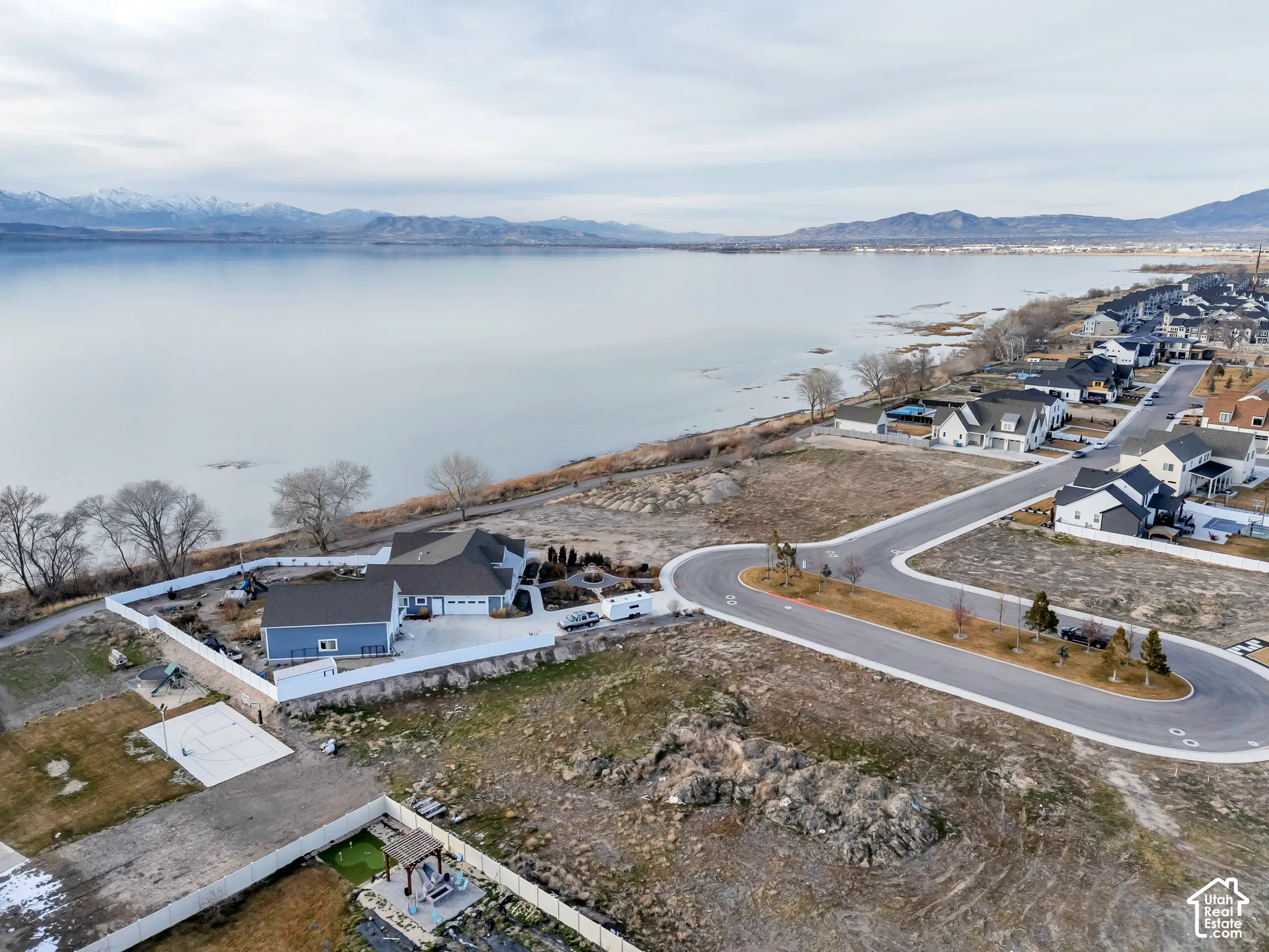 Aerial perspective of suburban area featuring a water and mountain view