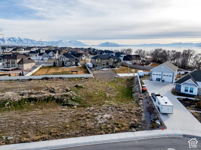 Aerial view of residential area featuring mountains