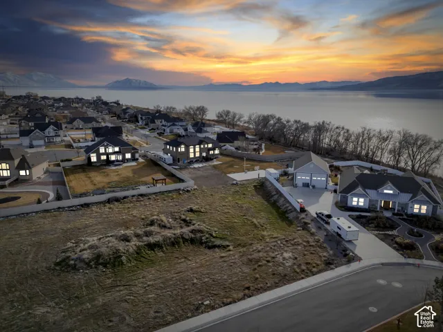Aerial view at dusk of a residential view and a water and mountain view