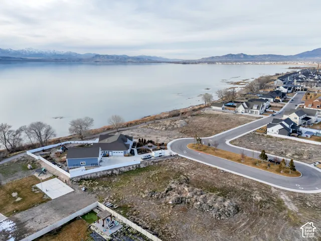 Aerial perspective of suburban area featuring a water and mountain view