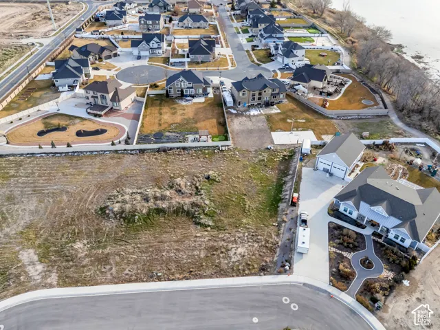 Aerial view of property and surrounding area with nearby suburban area