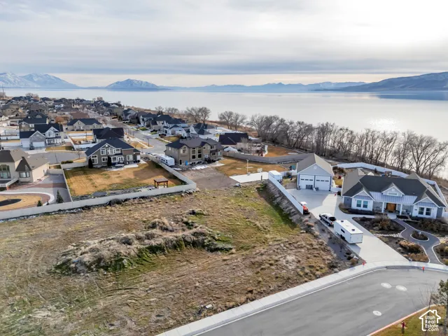 Aerial view of residential area featuring a water and mountain view