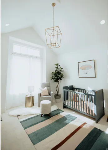 Carpeted bedroom with a nursery area, a chandelier, and a high ceiling