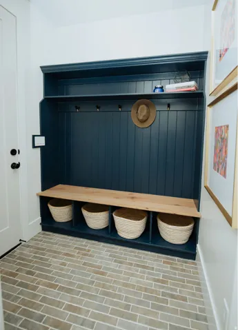 Mudroom with brick flooring