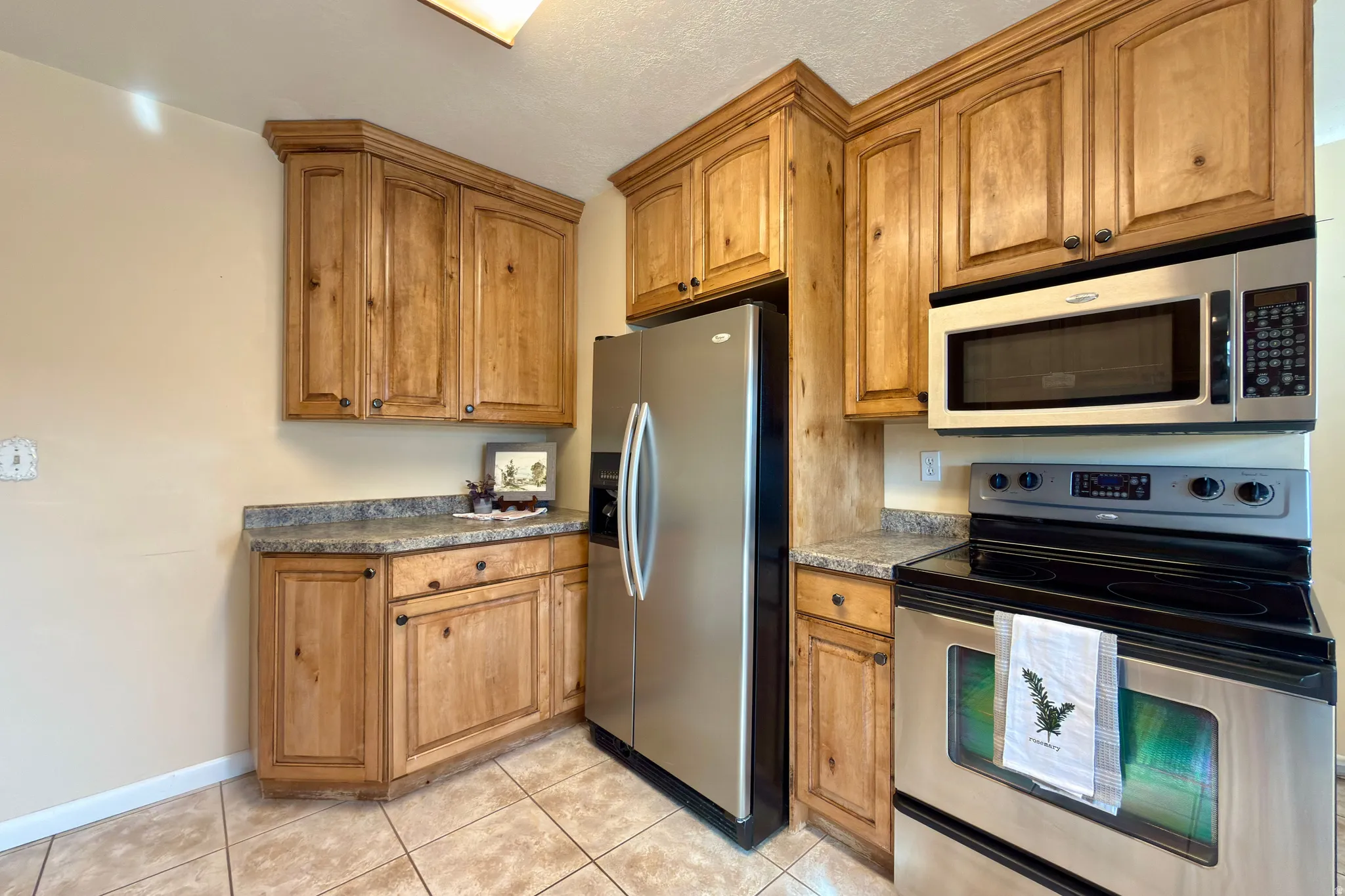 Fridge, microwave and range included.