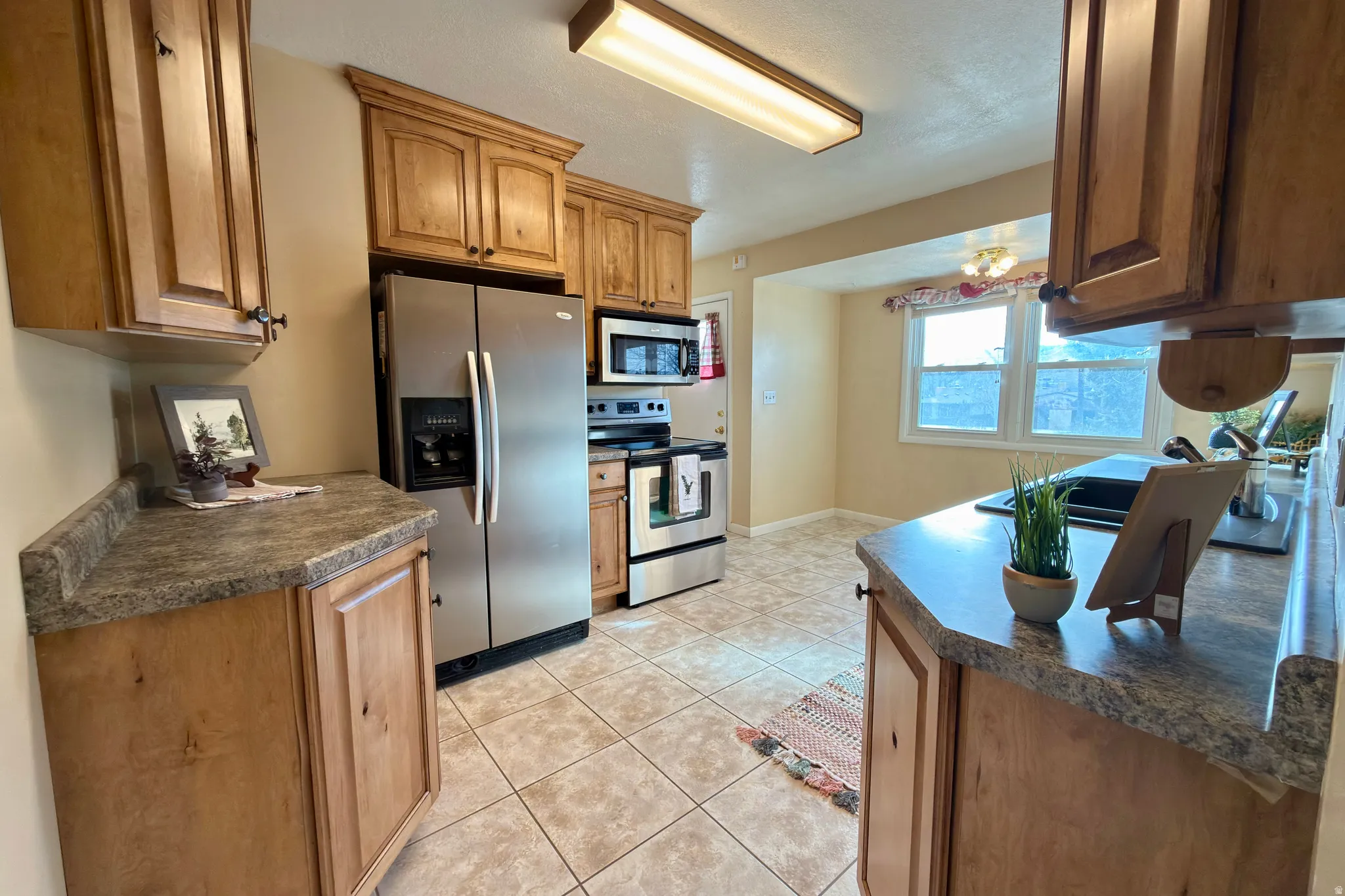Spacious kitchen with updated cabinets.