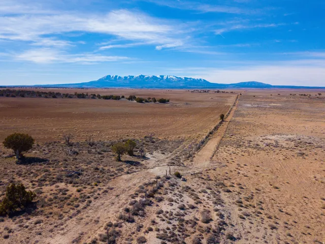 NW corner featuring neighboring property and mountain views