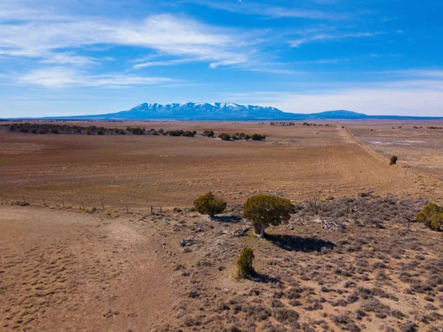NW corner featuring neighboring property and mountain views