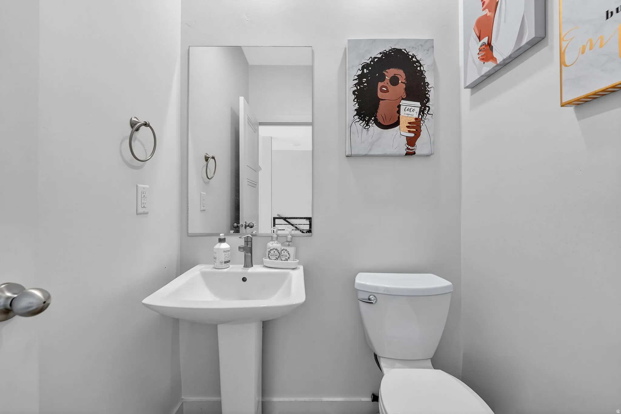 Half bath with toilet and baseboards