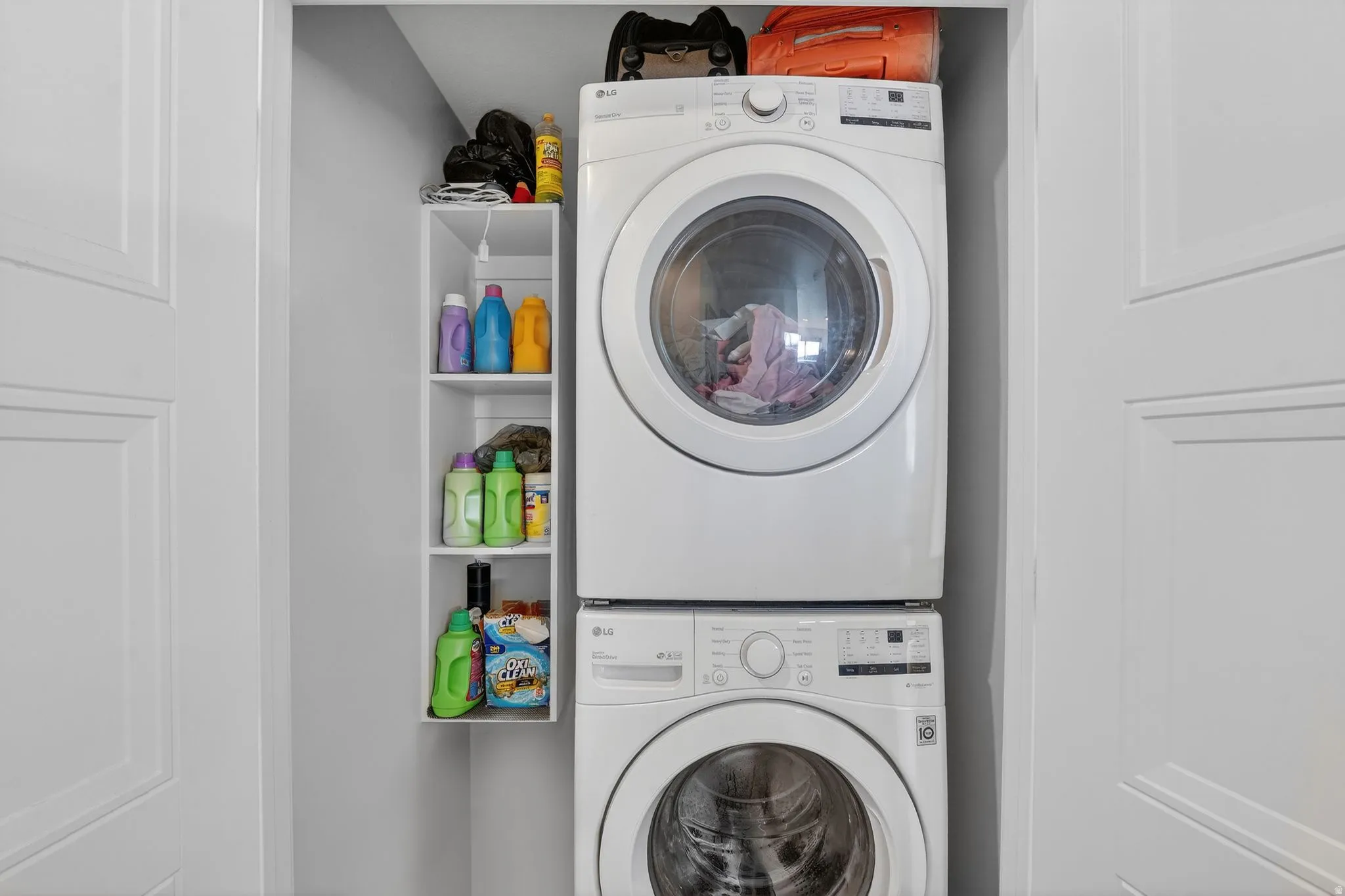 Laundry area featuring stacked washer / dryer