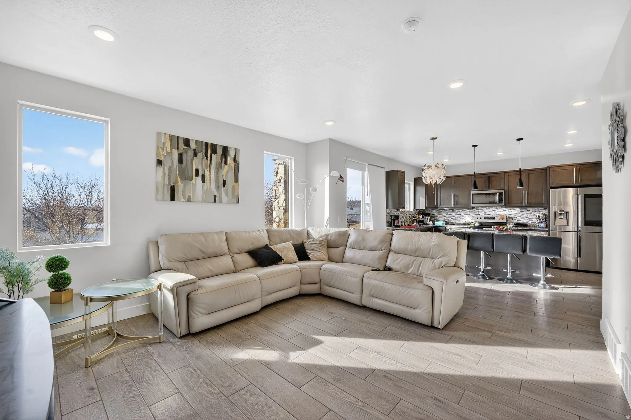 Living room with wood finish floors and recessed lighting