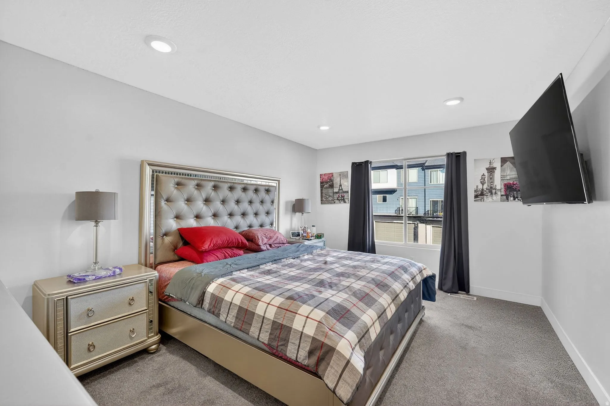 Bedroom with light colored carpet and recessed lighting