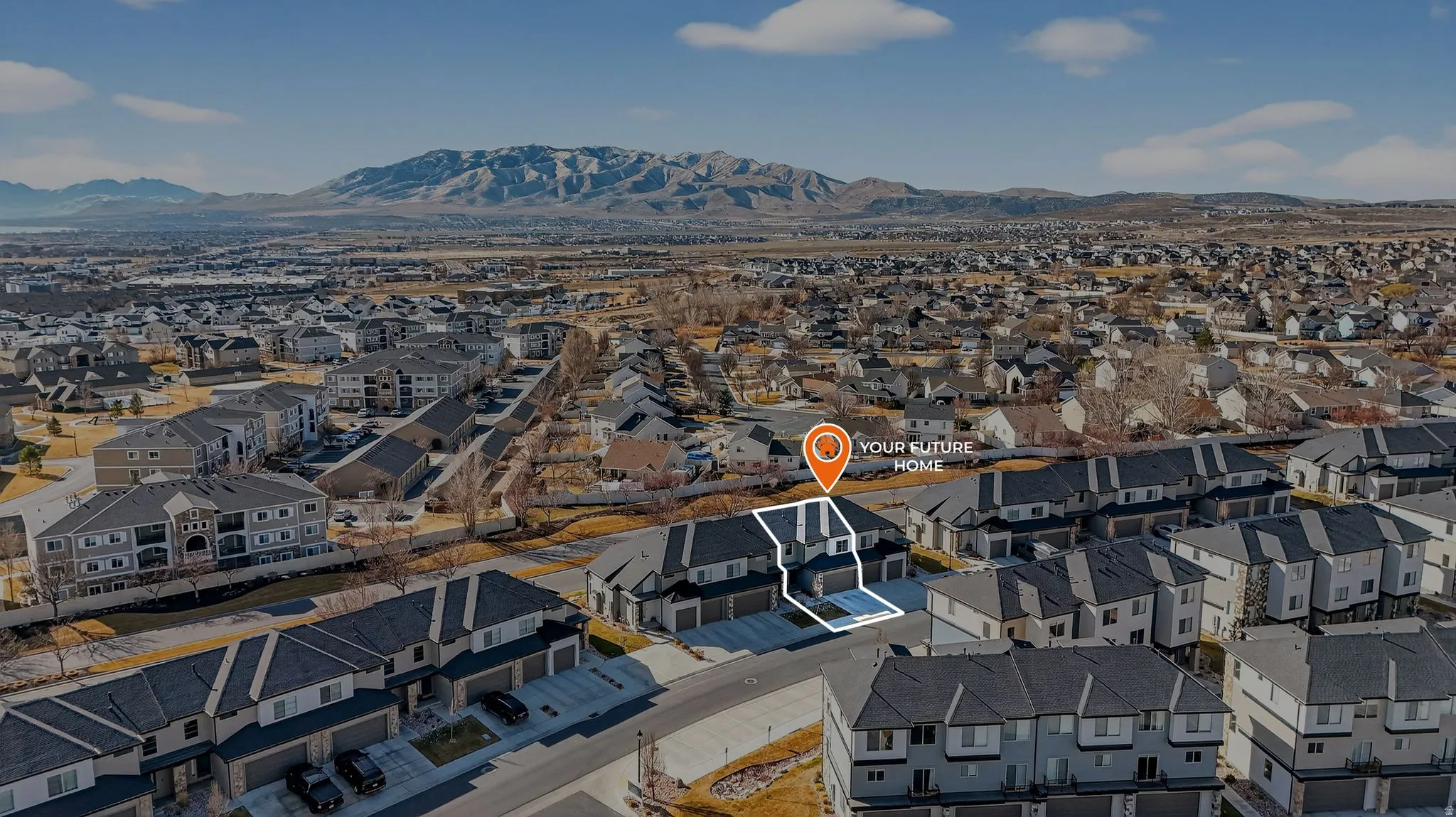 Aerial view of residential area with mountains