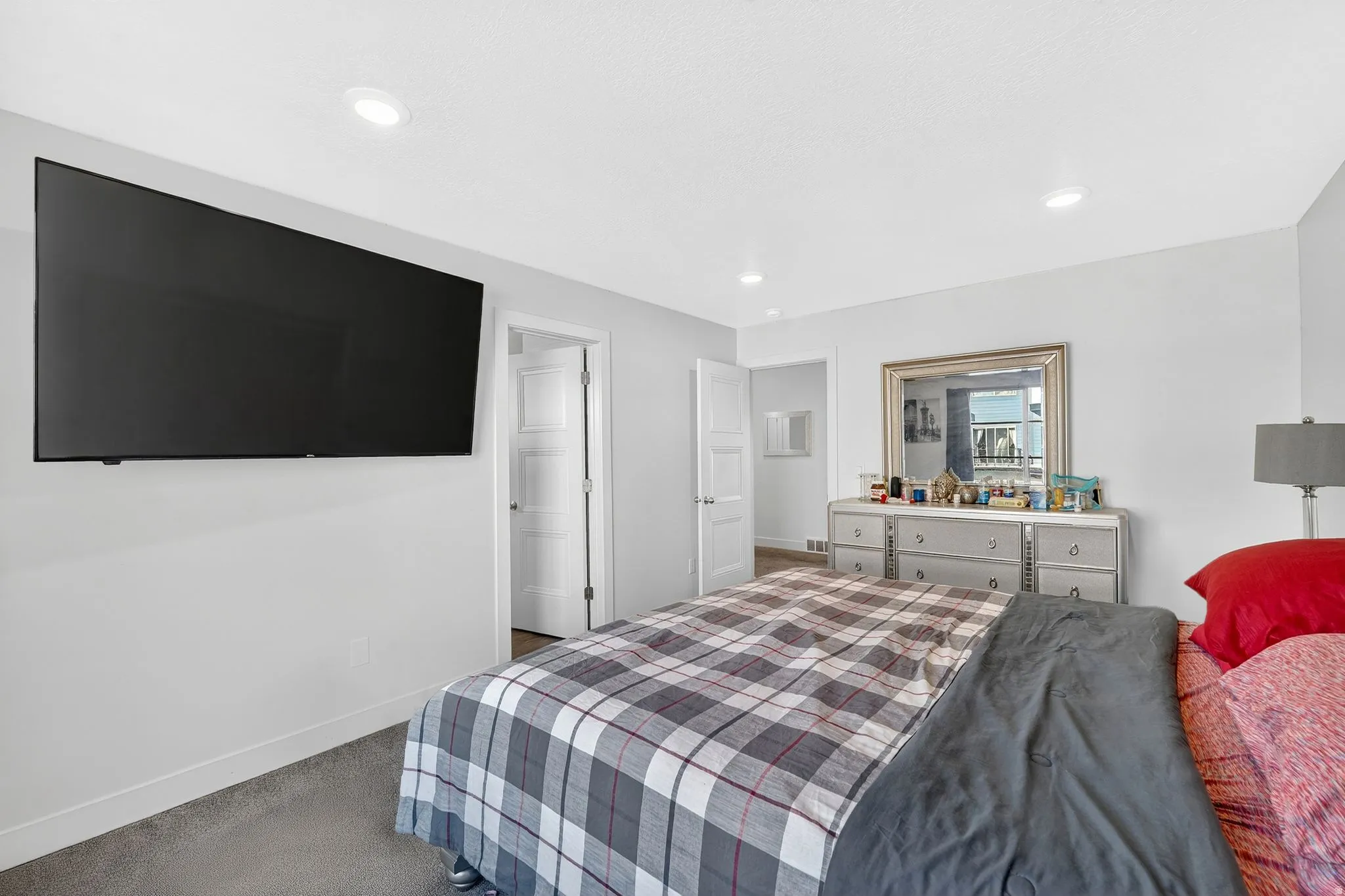 Bedroom with carpet floors and recessed lighting