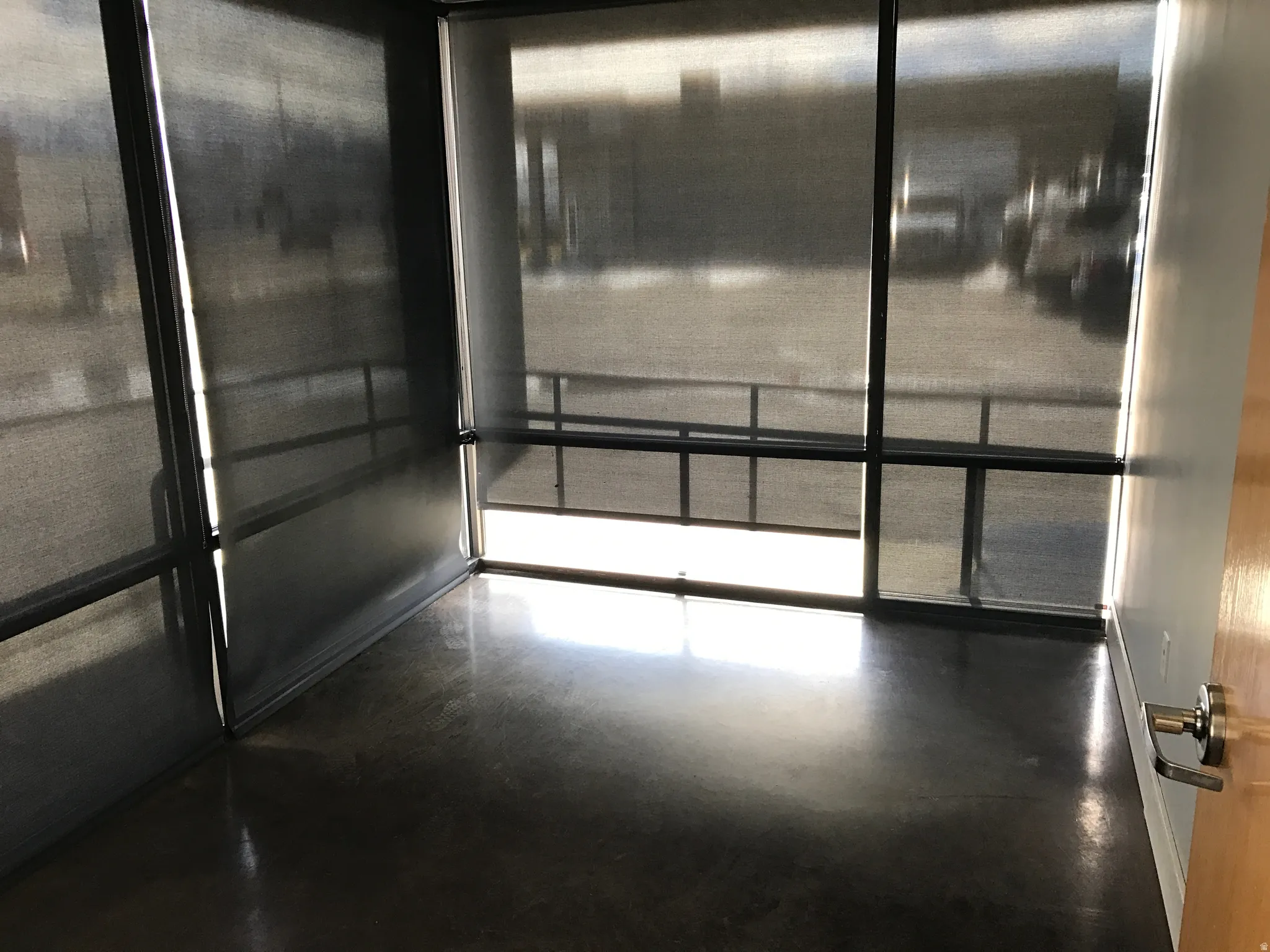 Detailed view of concrete flooring and elevator