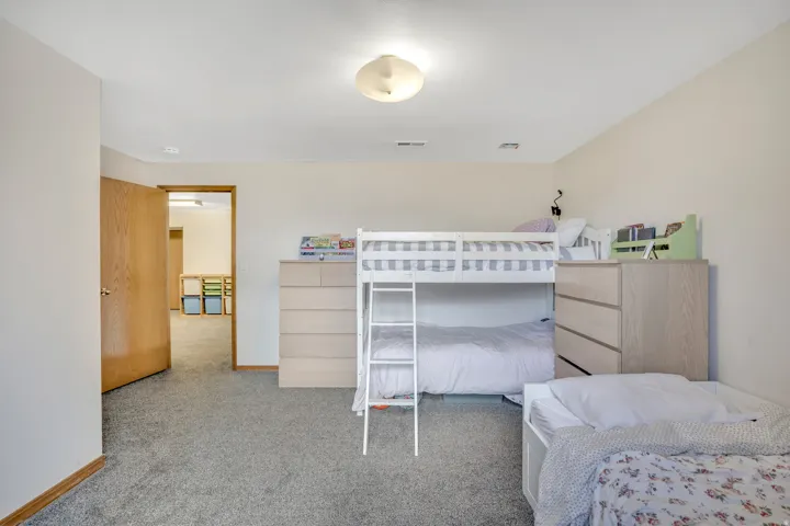 Carpeted bedroom with baseboards