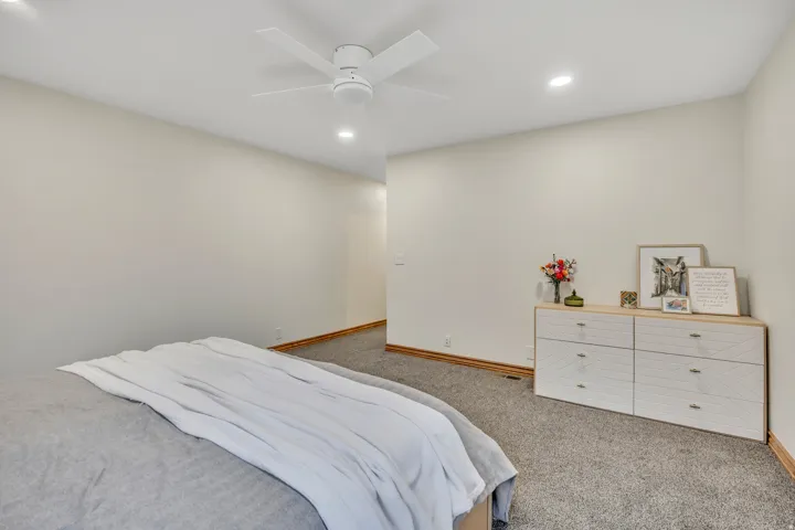 Bedroom featuring recessed lighting, carpet flooring, and ceiling fan