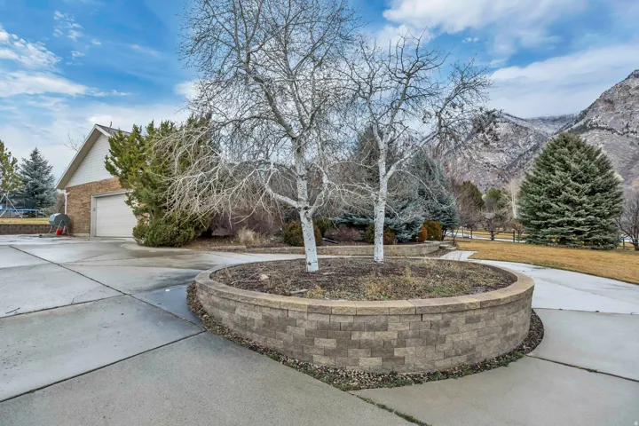 Surrounding community featuring driveway and a garage
