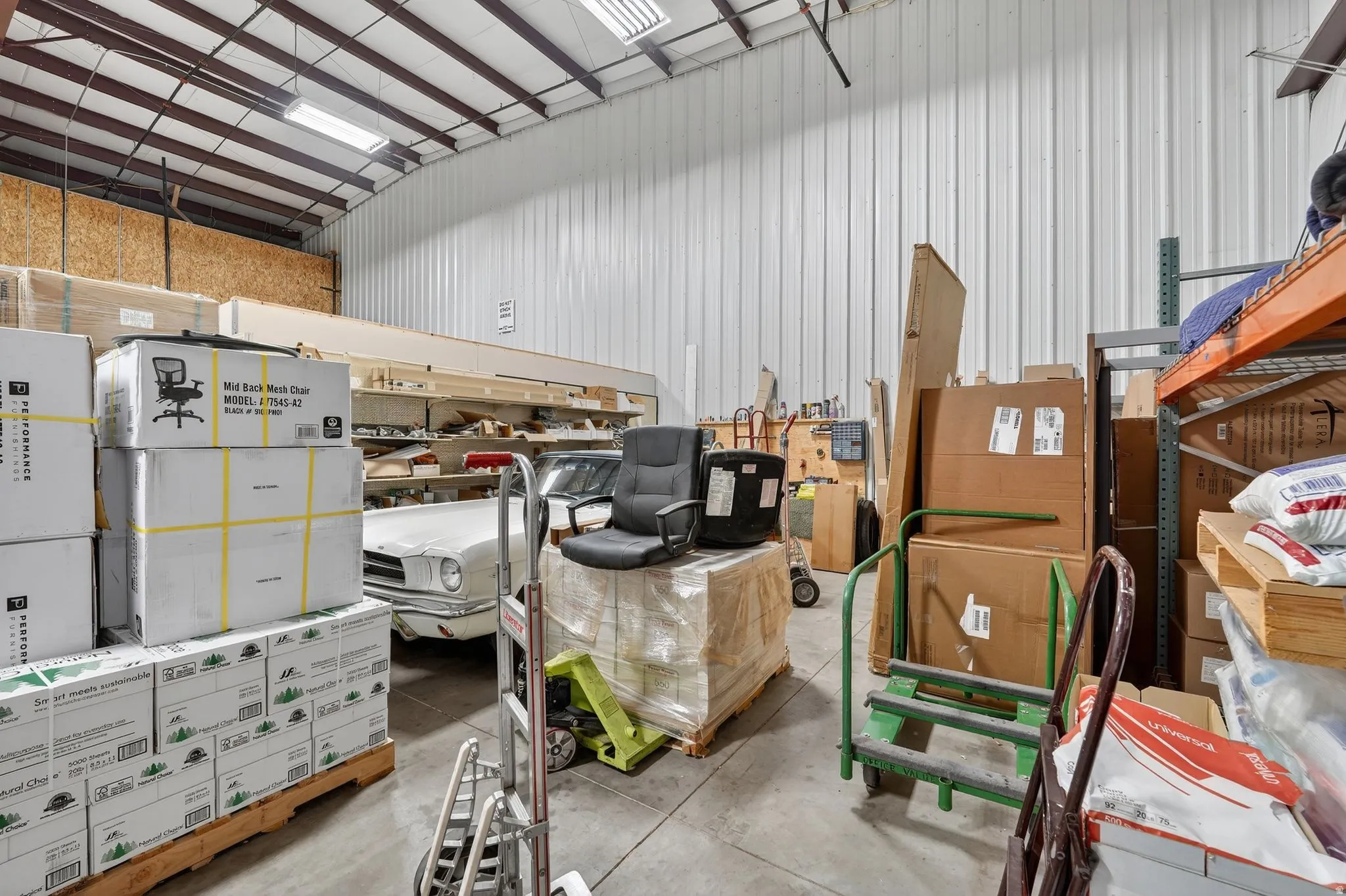 Garage featuring metal wall