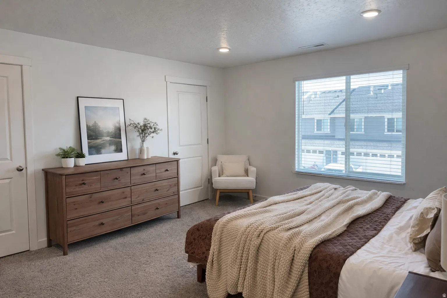 Bedroom featuring carpet flooring and a textured ceiling