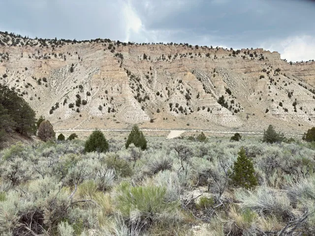 View of mountain background featuring rural landscape