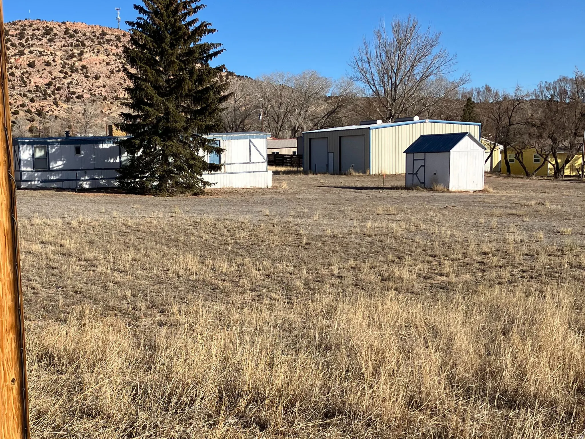 View of yard with a view of rural / pastoral area and an outdoor structure