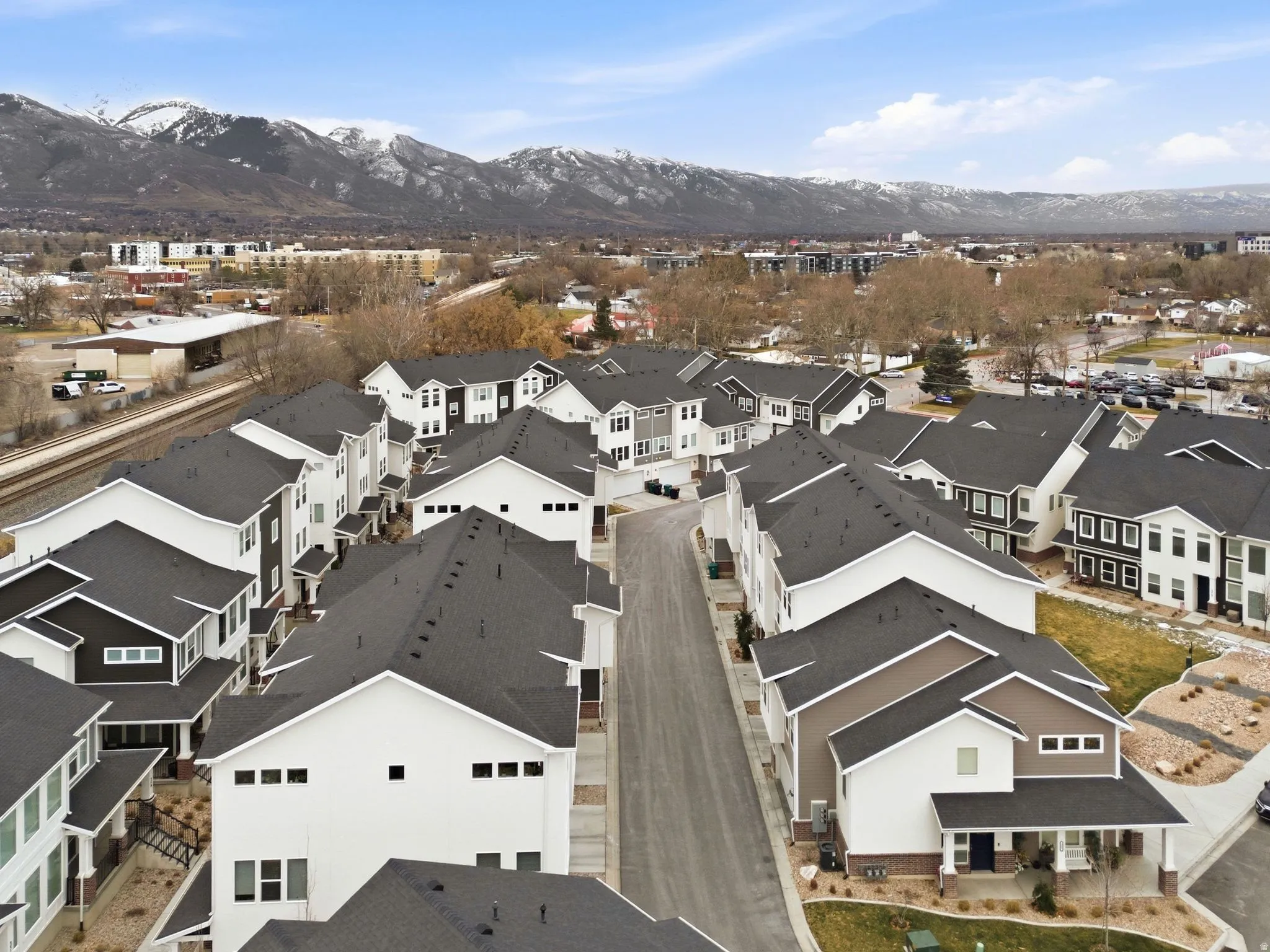 Aerial view of residential area featuring mountains