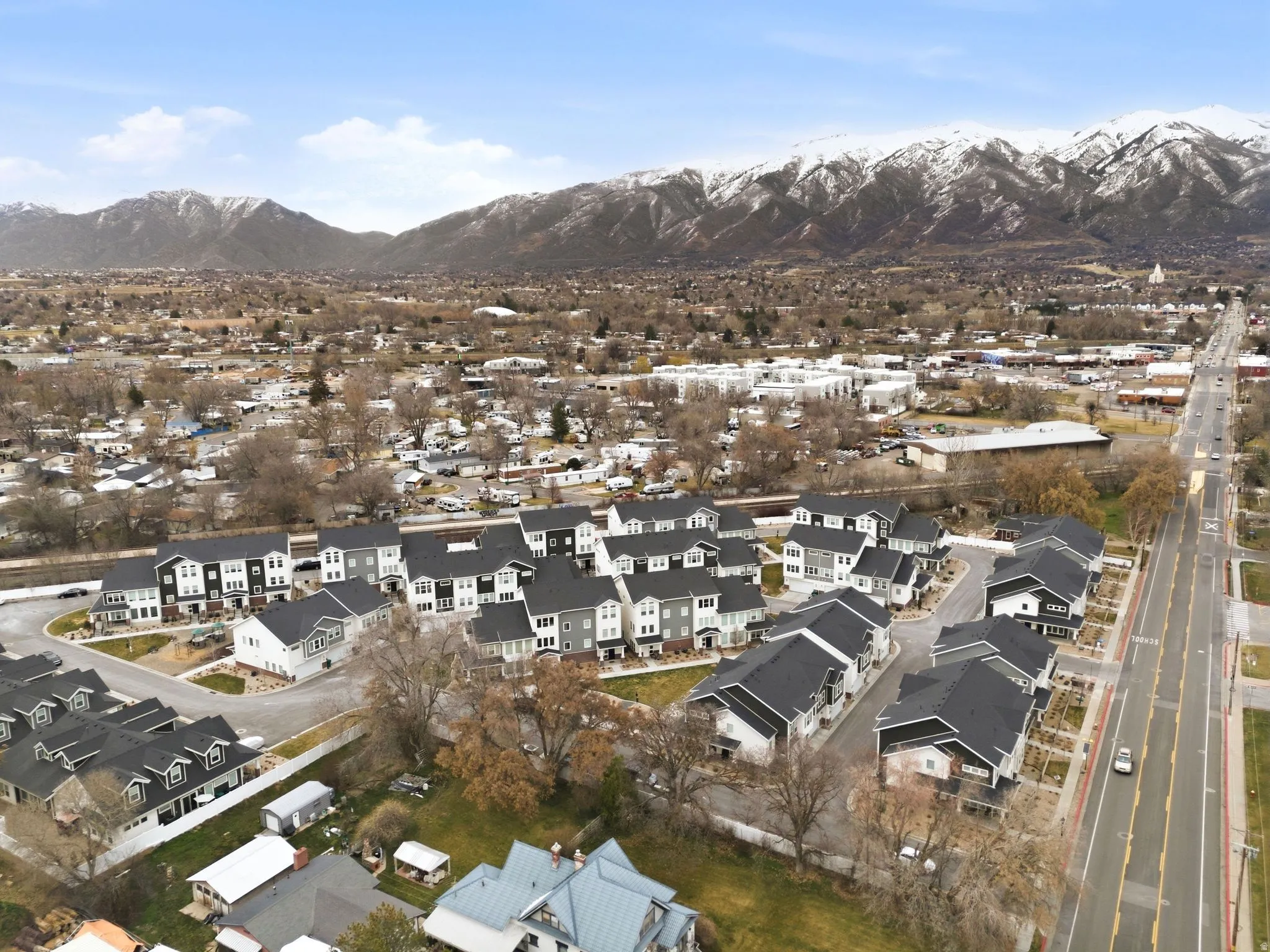 View of property location featuring mountains and nearby suburban area