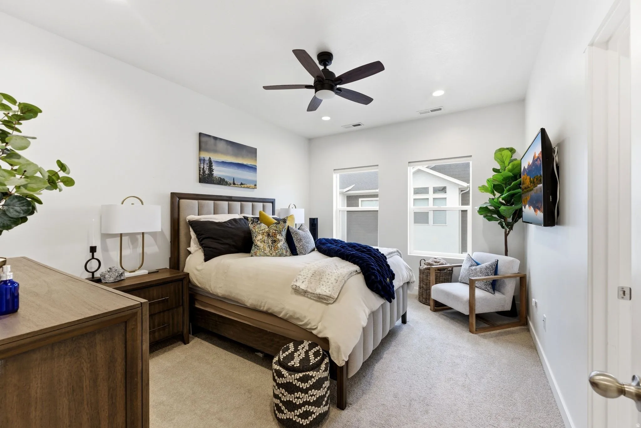 Bedroom featuring light carpet, a ceiling fan, and recessed lighting