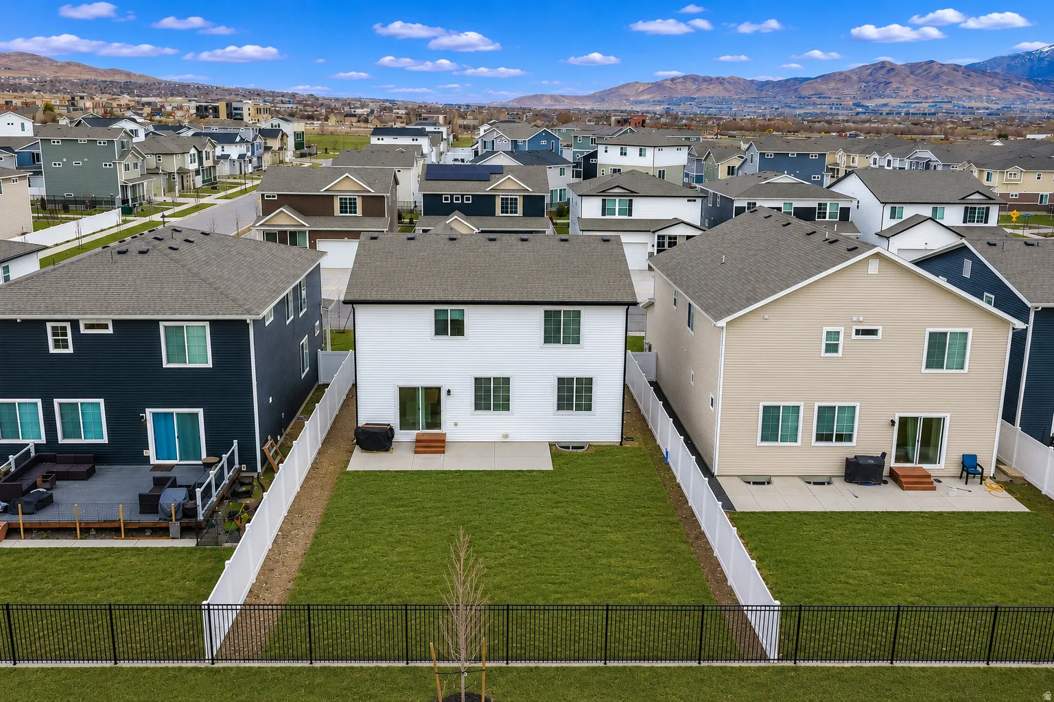 Expansive green lawn providing a blank canvas for outdoor living
