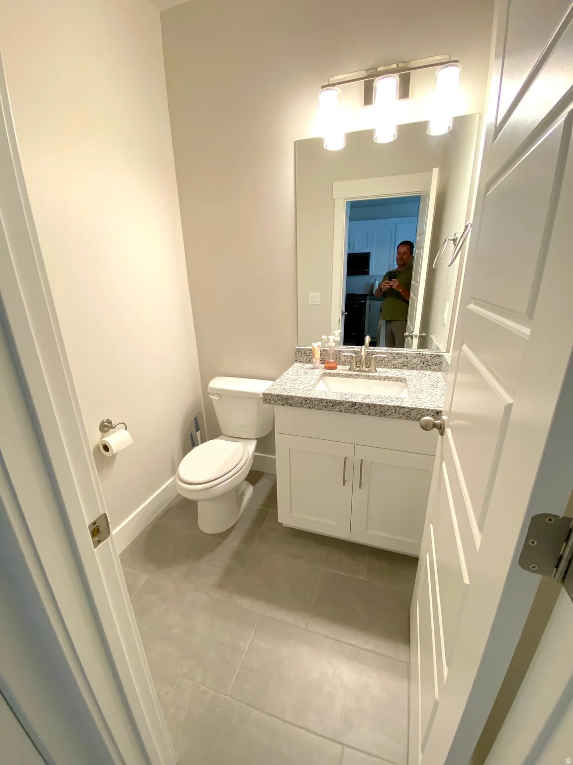 Half bathroom with seller being all proud of his works
