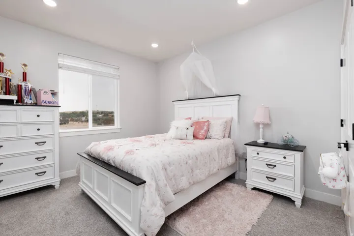 Bedroom featuring light carpet and recessed lighting
