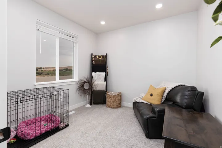 Sitting room featuring light carpet and recessed lighting