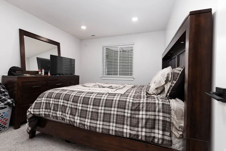 Carpeted bedroom featuring recessed lighting