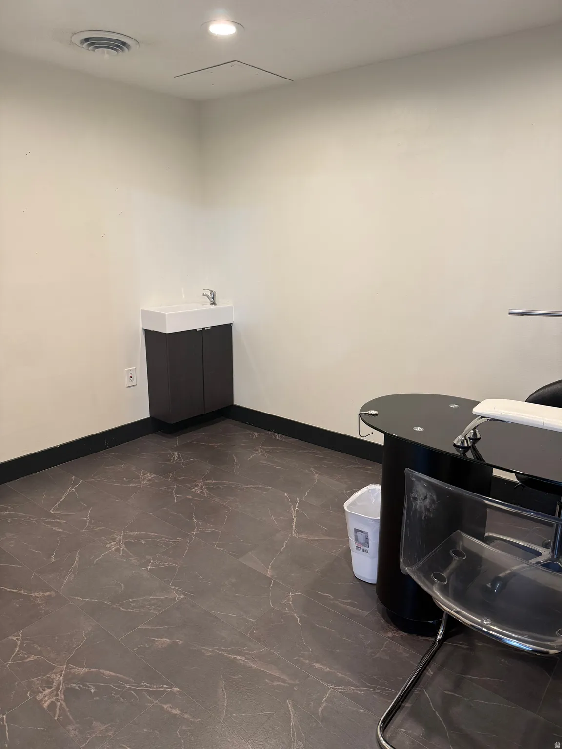 Bathroom with vanity and recessed lighting