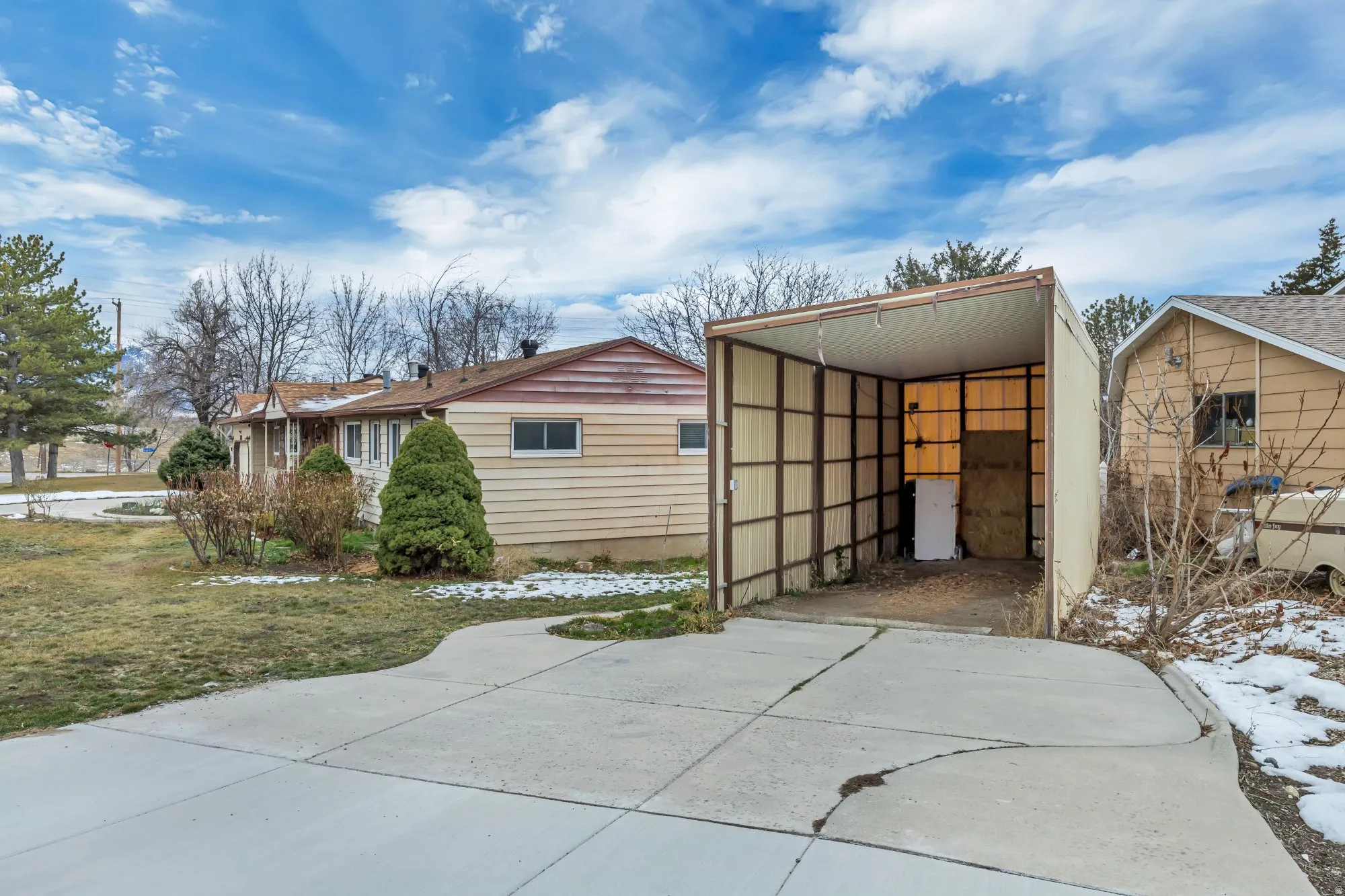 Additional covered RV-style parking with extended side access, offering flexibility for recreational vehicles, equipment storage, or potential future enclosure.