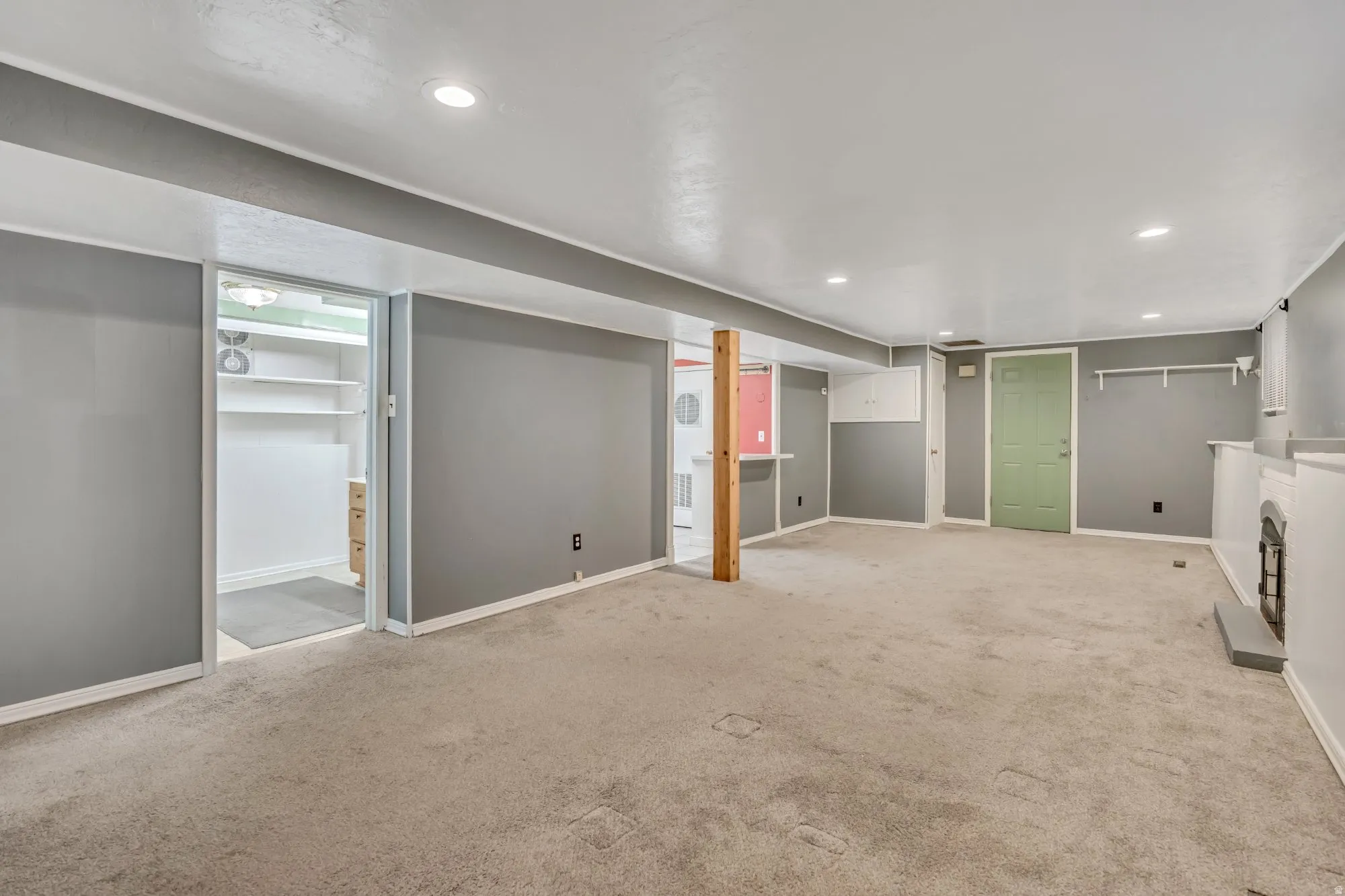 Expansive lower-level living area with open layout, ideal for separate living quarters, guest space, or income-producing configuration.
