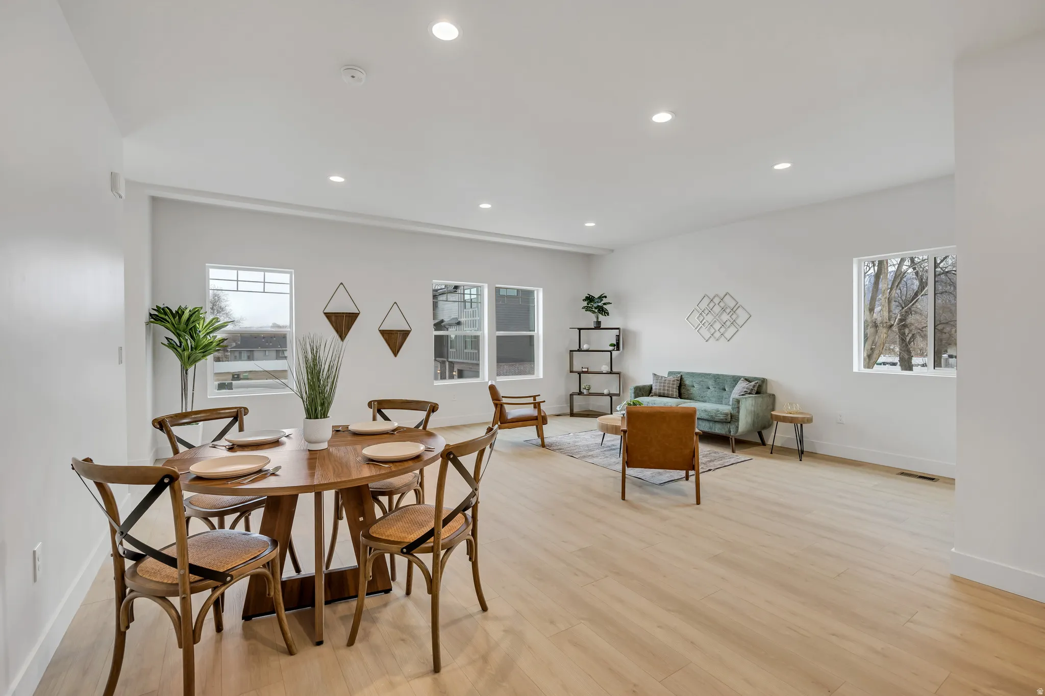 Dining area featuring light wood-style floors and recessed lighting