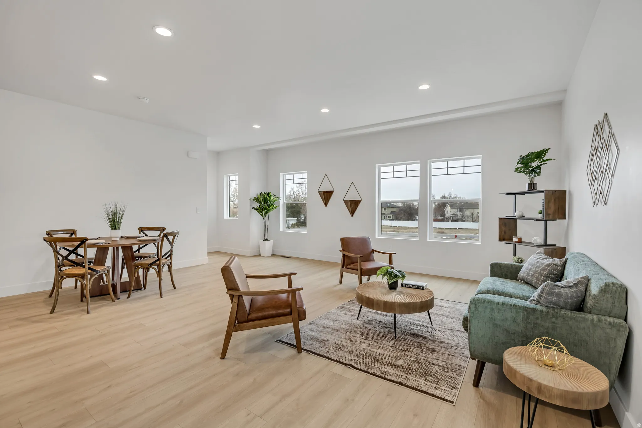 Living room with recessed lighting and light wood finished floors