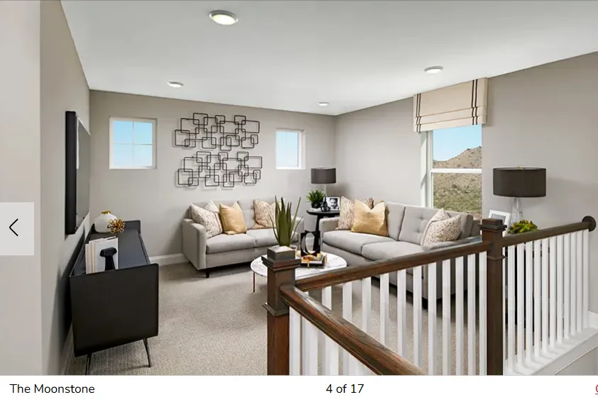 Carpeted living room featuring baseboards