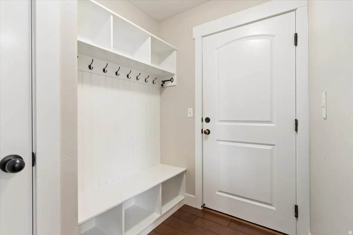 Mudroom featuring dark wood-type flooring