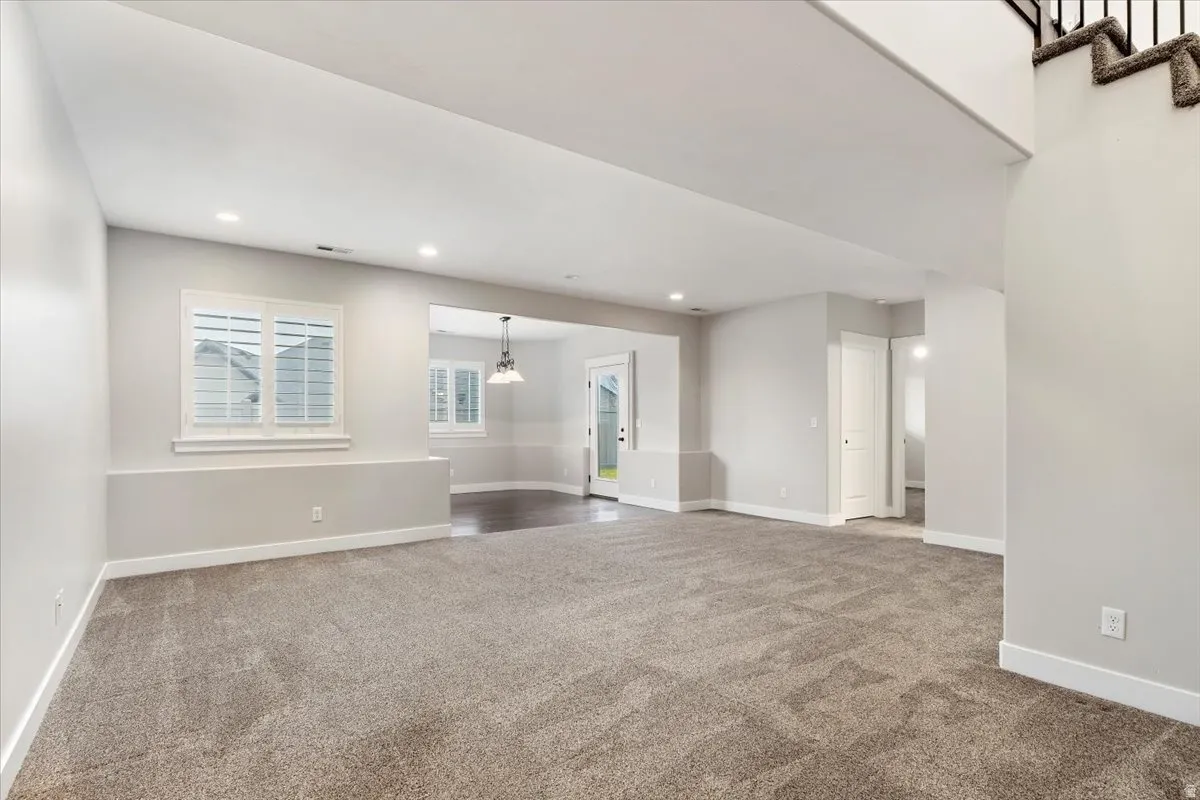 Unfurnished room featuring light colored carpet and recessed lighting