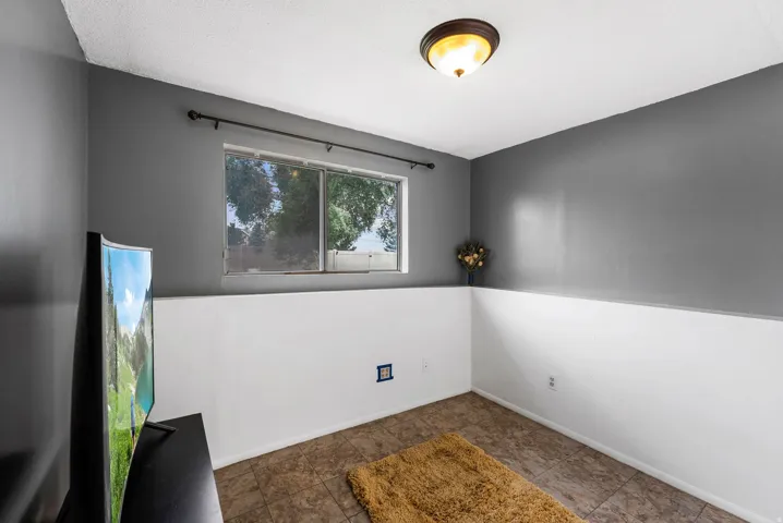 Spare room featuring baseboards