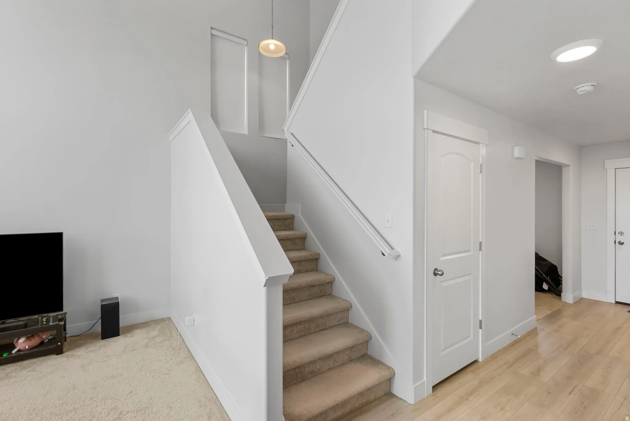 Stairway featuring baseboards